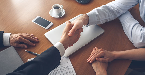 Young couple consultation with agent purchase rent property real estate handshake
